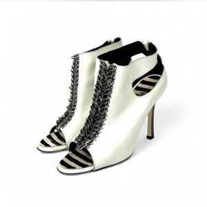 Manolo Blahnik white leather peep-toe bootie with zebra calf and chain detail.